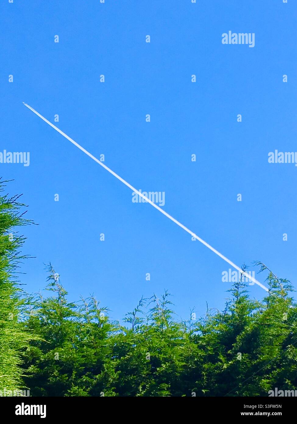 Plane flying though sky - Smartphone Captured Stock Image