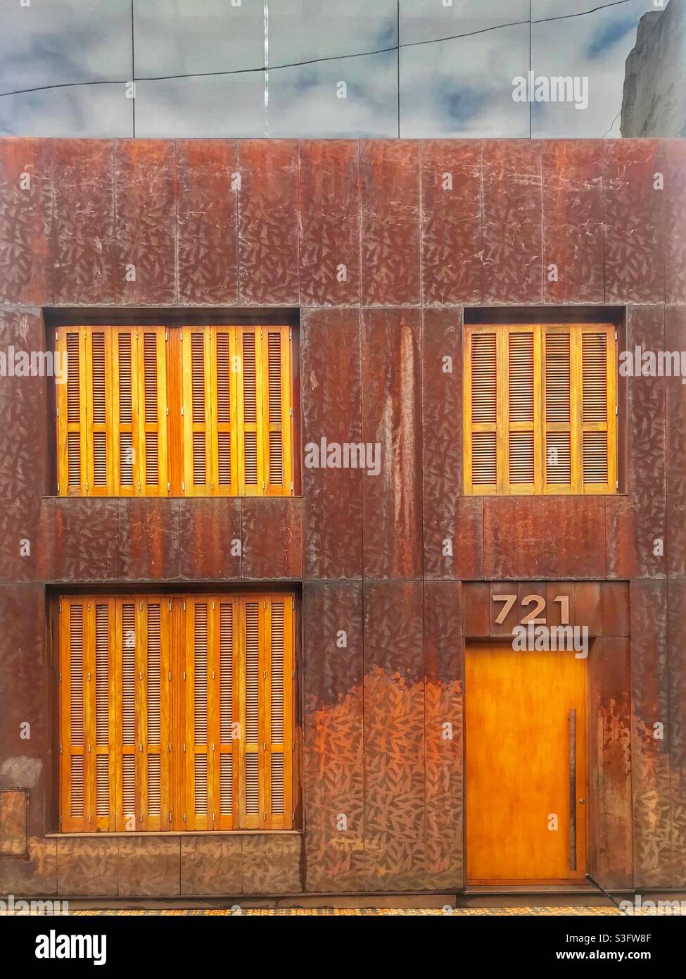 Modern building with a rusted metal facade in San Telmo, Buenos Aires, Argentina - Smartphone Captured Stock Image