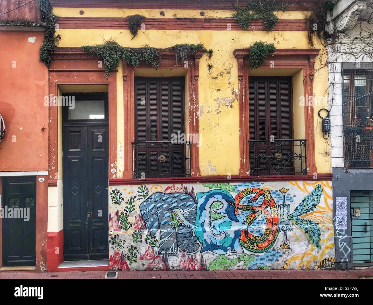 Street art and old buildings in San Telmo, Buenos Aires, Argentina - Smartphone Captured Stock Image