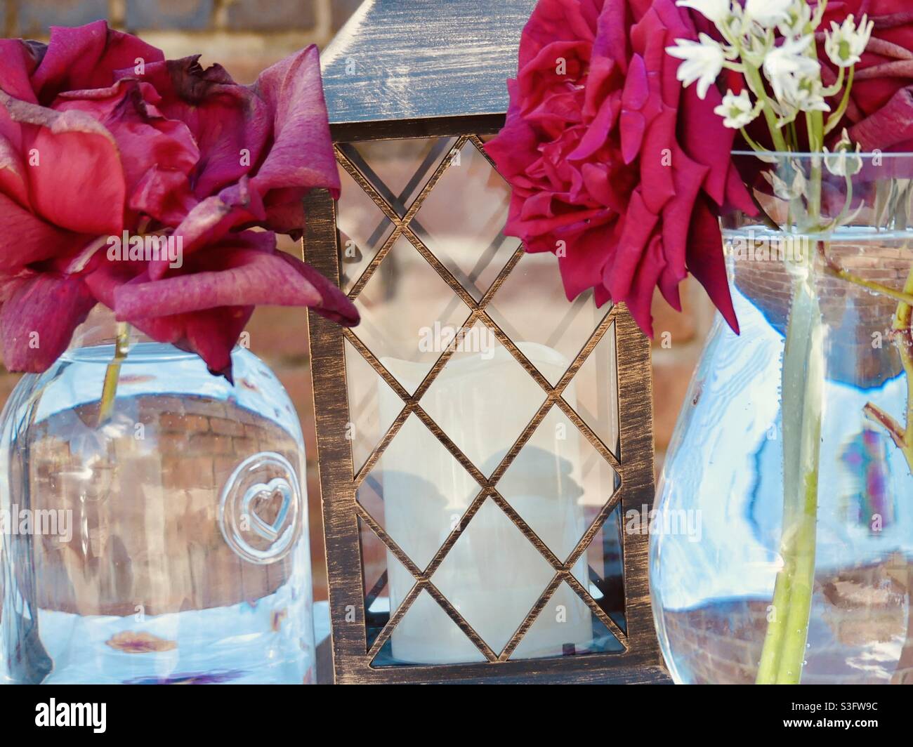 Garden party with flowers and a lantern Stock Photo