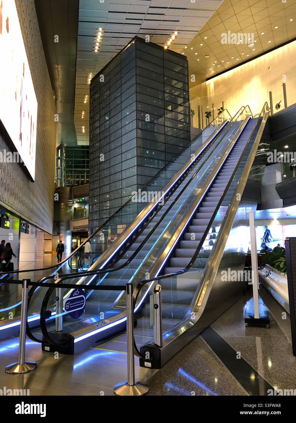 Escalator in the transit area of Hamad International Airport, Dohah, Qatar during the Covid-19 pandemic, May 2021. Stock Photo