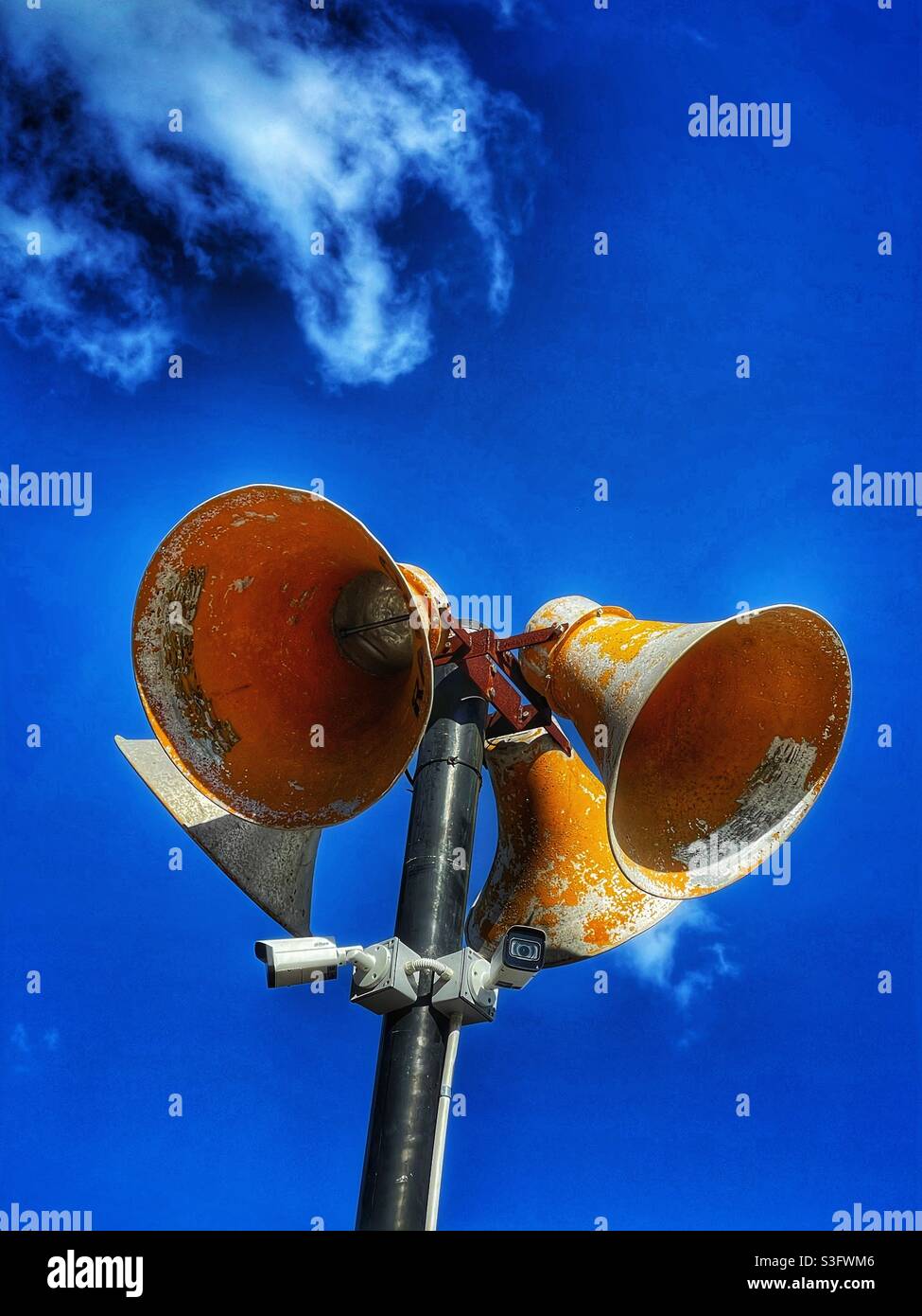 Public address speakers and surveillance cameras - Smartphone Captured Stock Image