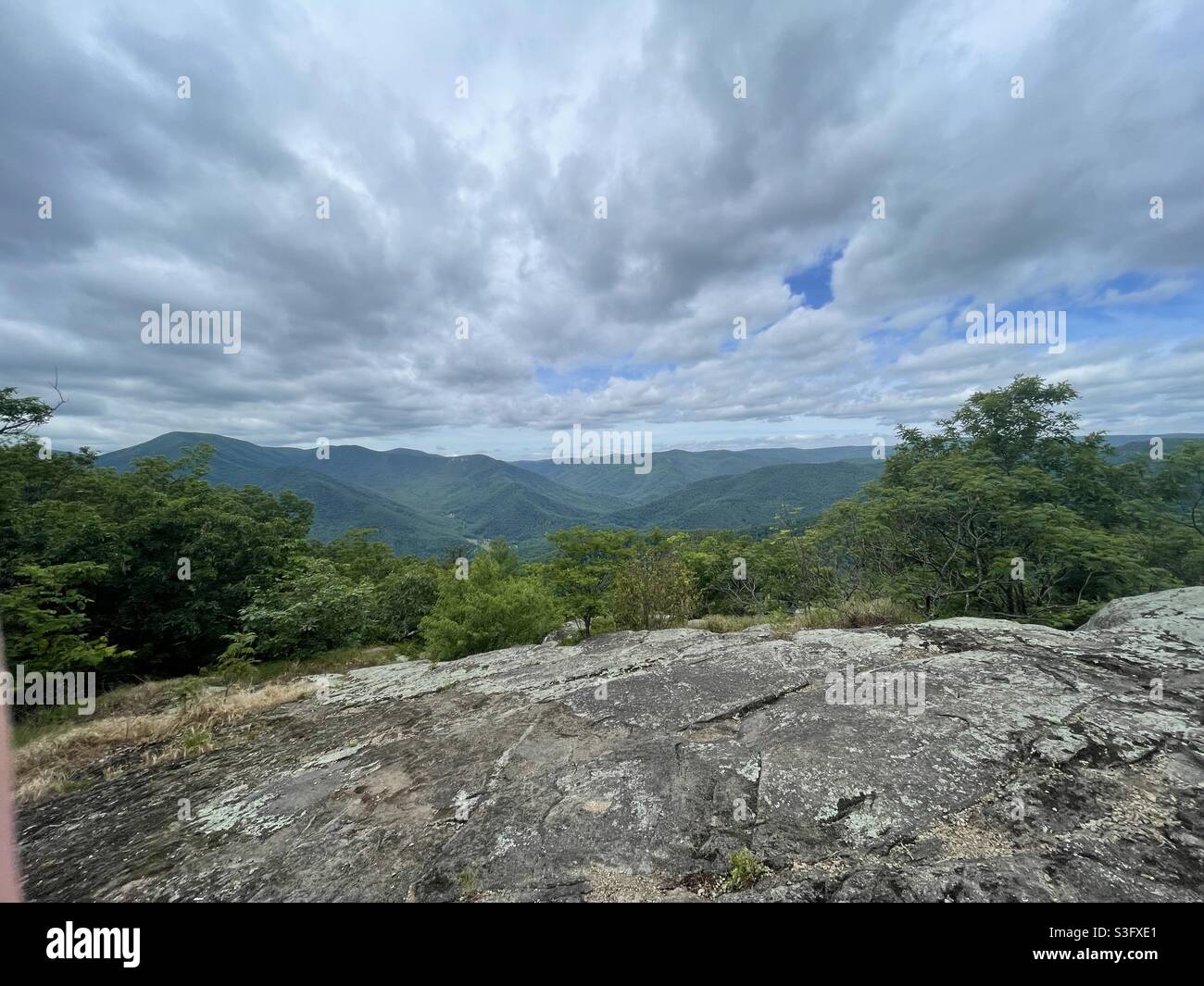 Clouds sky over the summit of a Virginia mountain peak along the Appalachian Trail. Stock Photo