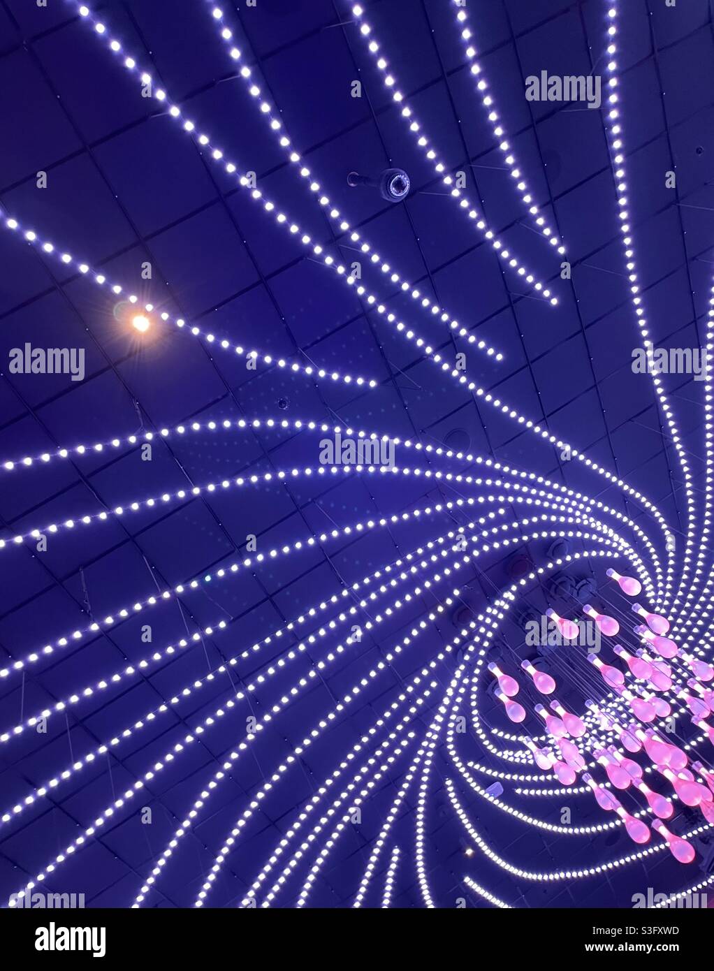 Swirly neon ceiling lights - Smartphone Captured Stock Image