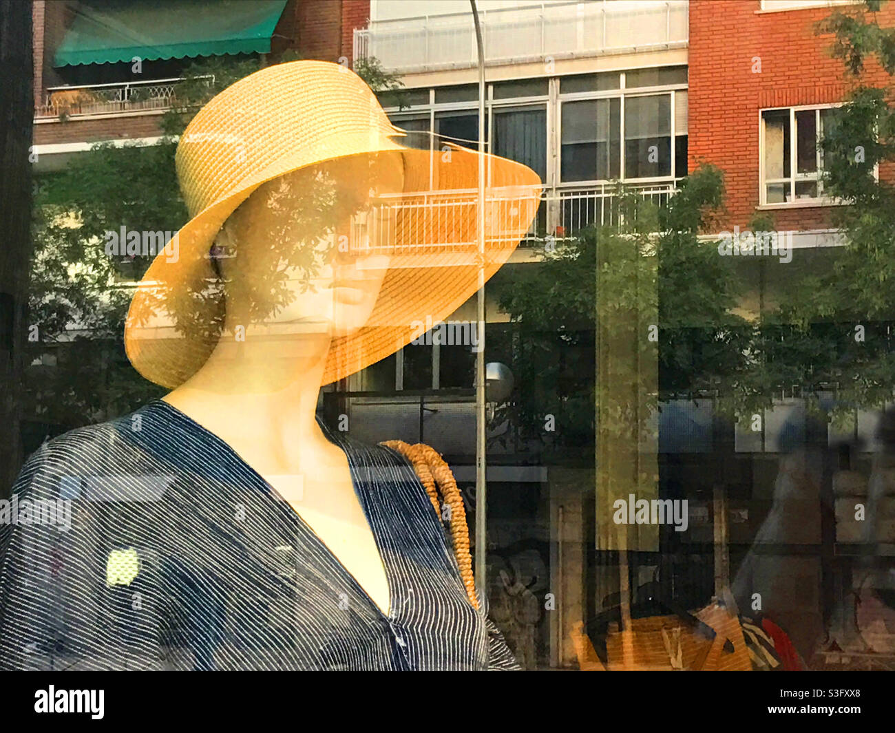 Mannequin wearing hat in a shop window Stock Photo Alamy