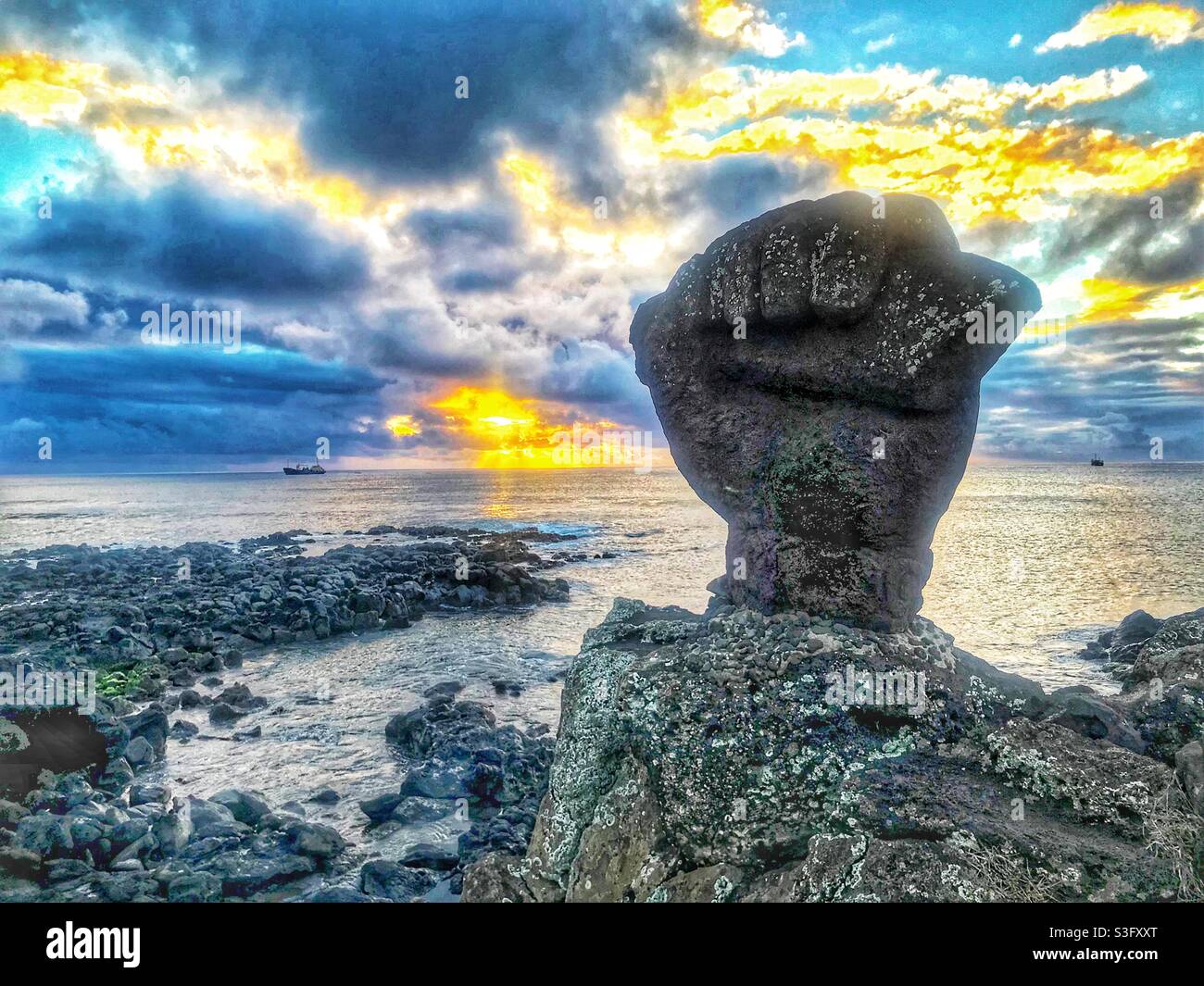 Sunset view of Fist statue at Tahai, Easter Island - Smartphone Captured Stock Image