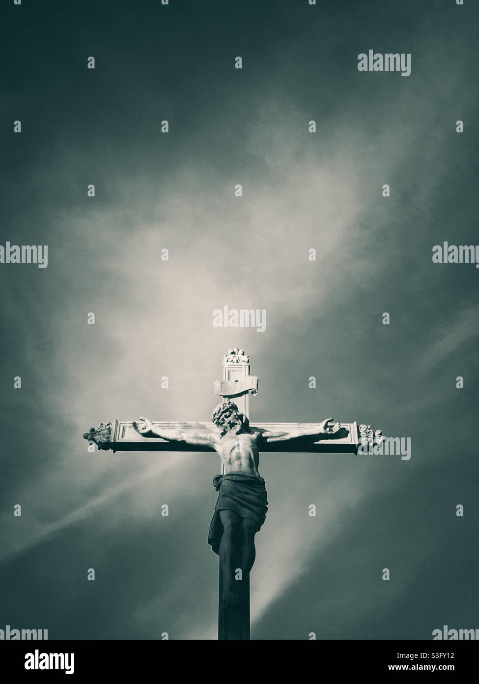 A statue of Jesus Christ on the cross outside the Church of All Saints, Clifton, Bristol Stock Photo