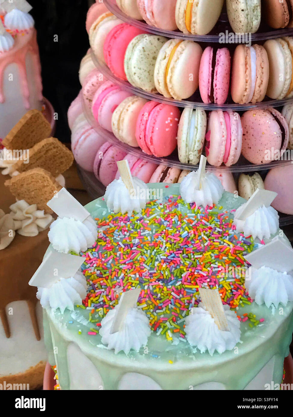 A beautiful display of cakes and macaroons in a shop window in Bristol. - Smartphone Captured Stock Image