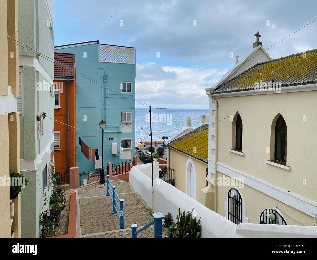 Looking past the church Our lady of sorrows in Catalan bay village, Gibraltar towards the Mediterranean Sea Stock Photo