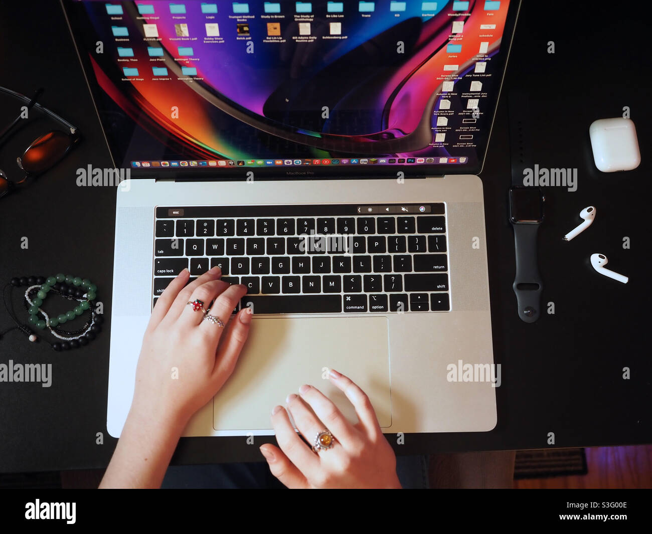 Hands on laptop, working and studying remotely from home, TopView female hands - Smartphone Captured Stock Image