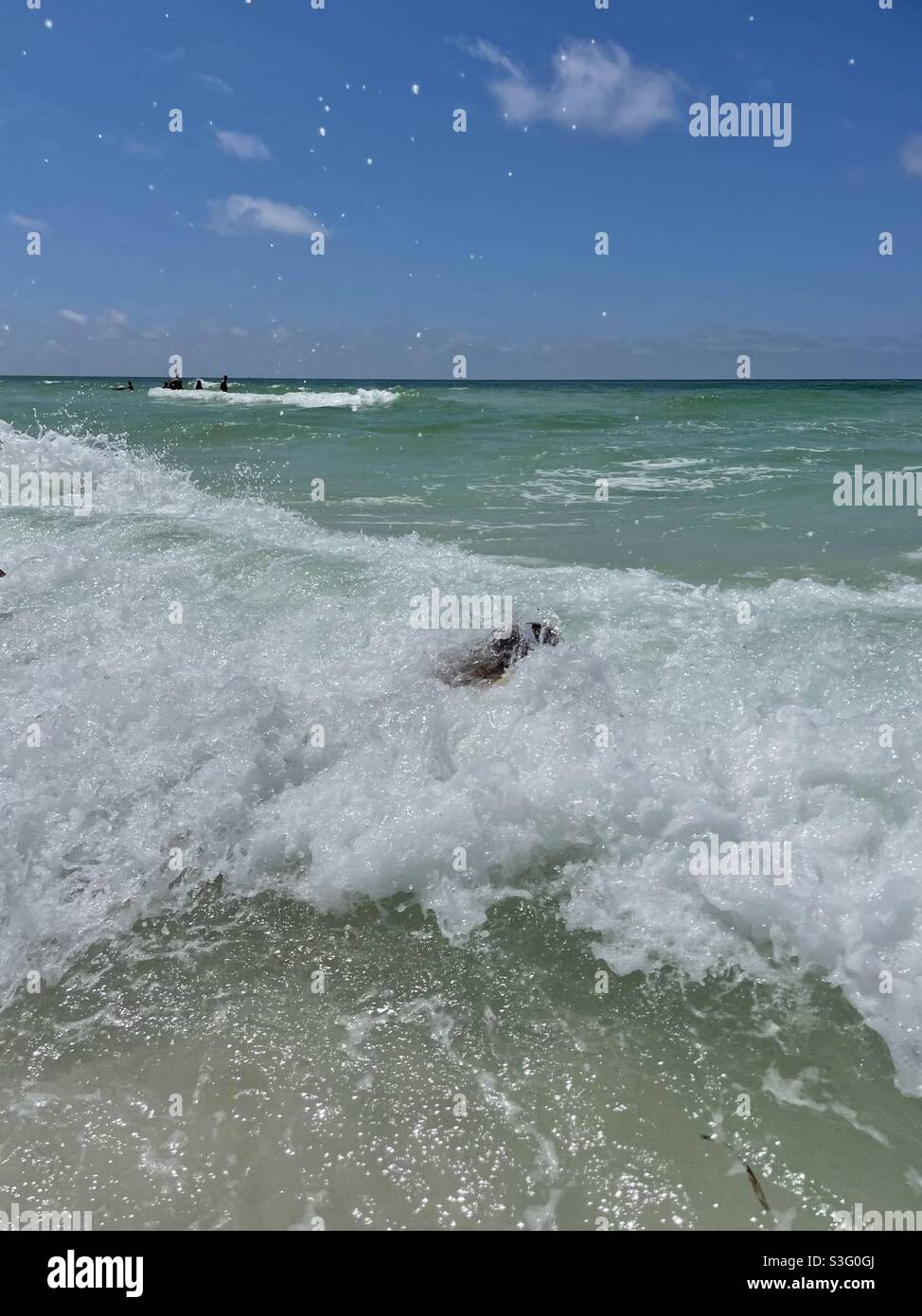 Person submerged in large ocean waves - Smartphone Captured Stock Image