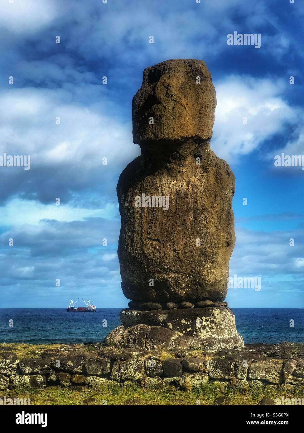 Moai at Tahai complex with a cargo ship in the background, Easter Island, Chile - Smartphone Captured Stock Image