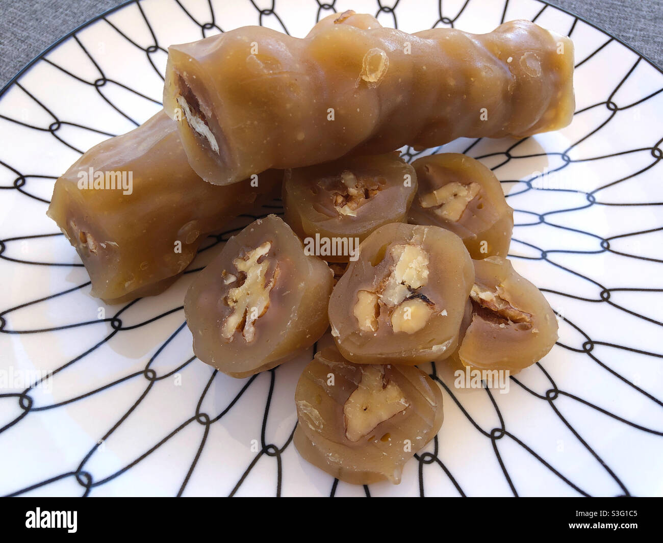 Walnut Soutzoukkos, some sliced, a traditional Cypriot sweet treat made