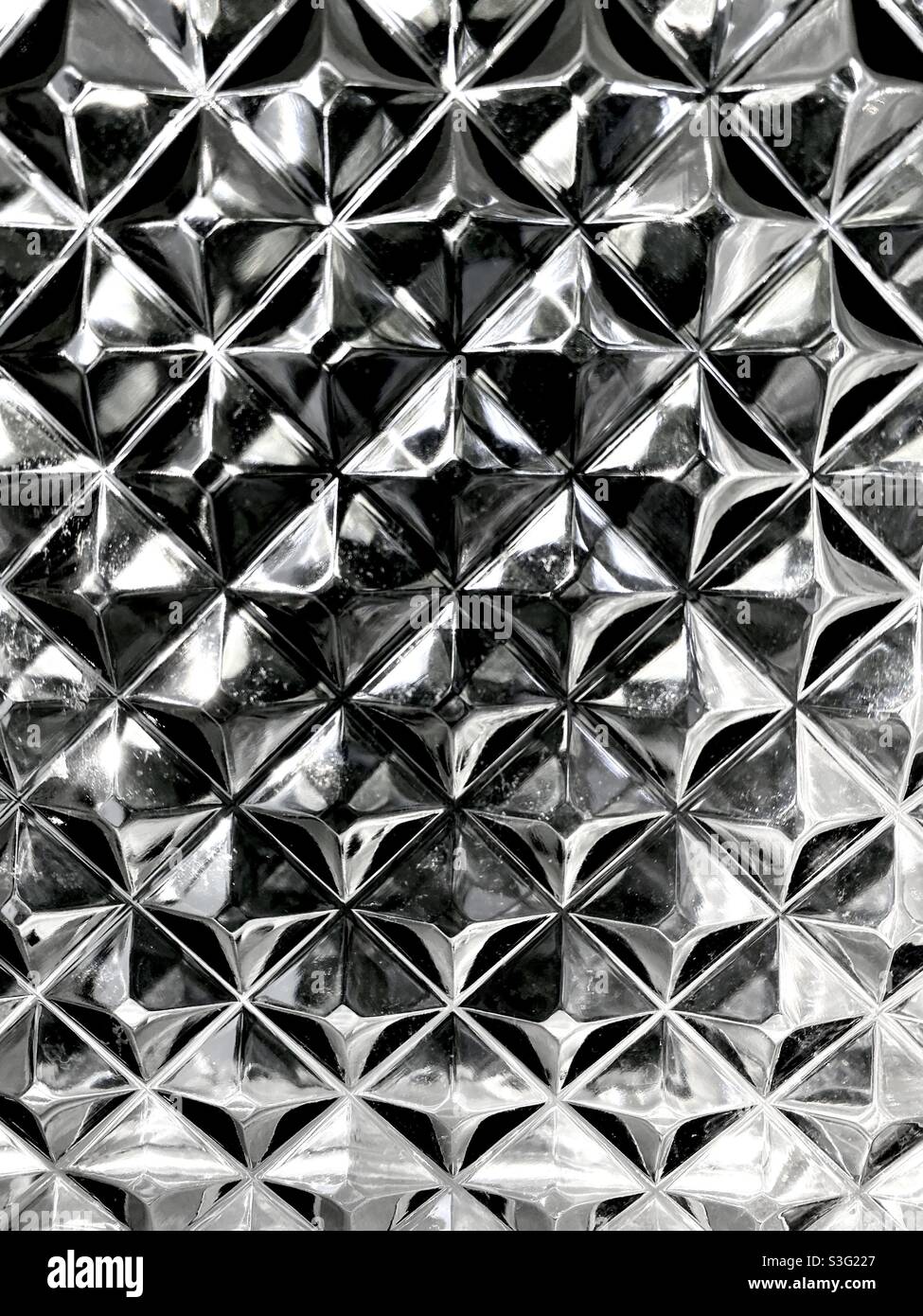 Pyramid pattern black and white crystal in glass block Stock Photo