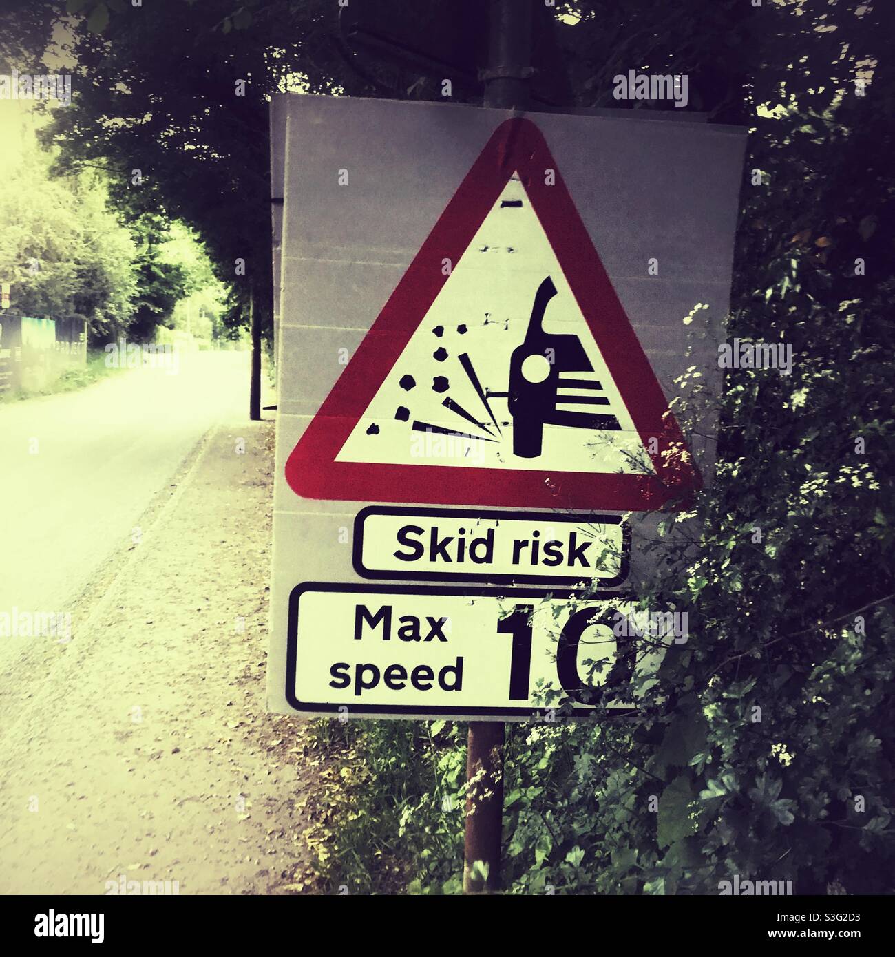 Skid risk hazard warning sign, Hampshire, England, United Kingdom. Stock Photo