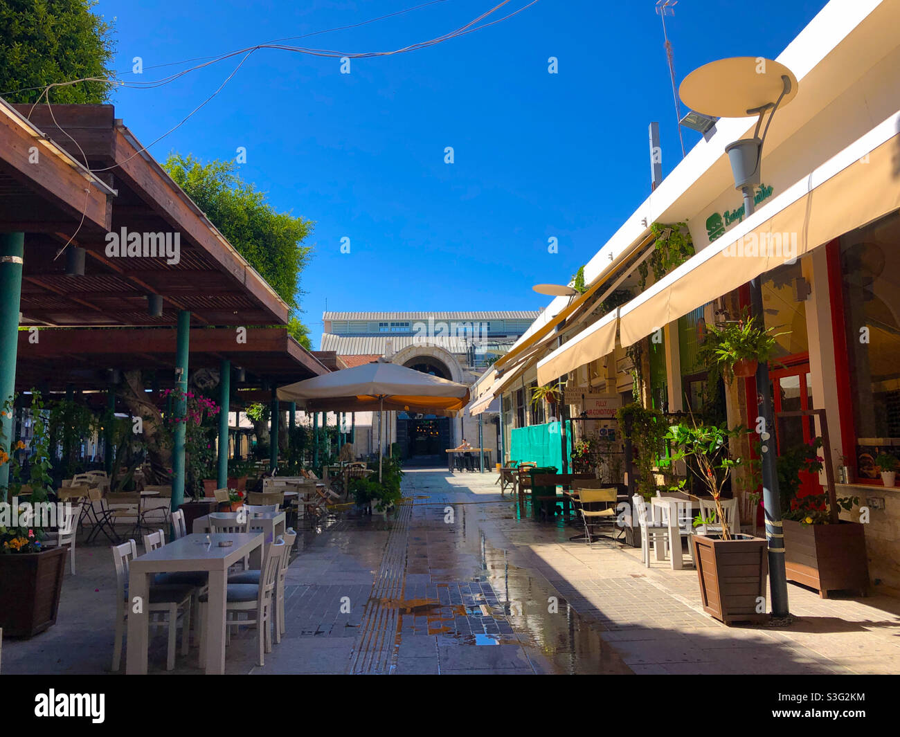 Outdoor cafes near the Limassol Agora, a recently renovated indoor market in Limassol, Cyprus. - Smartphone Captured Stock Image