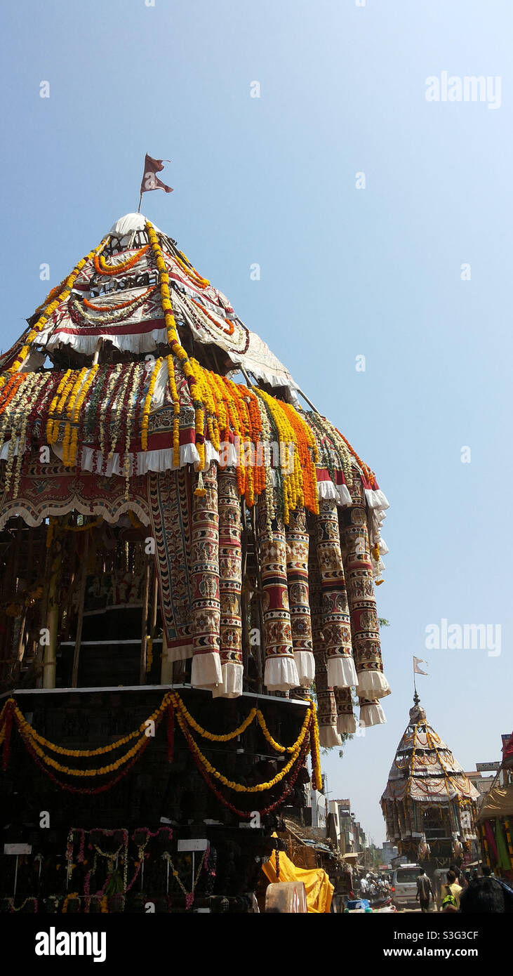 Temple car festival is being celebrated in some part of Tamilnadu in south India. In this Hindu festival thousand of people throng to participate in pulling chariot through the streets. Stock Photo