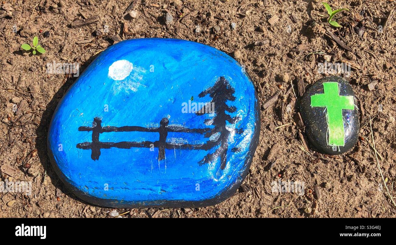 High angle view of painted stones laying on the earth. - Smartphone Captured Stock Image