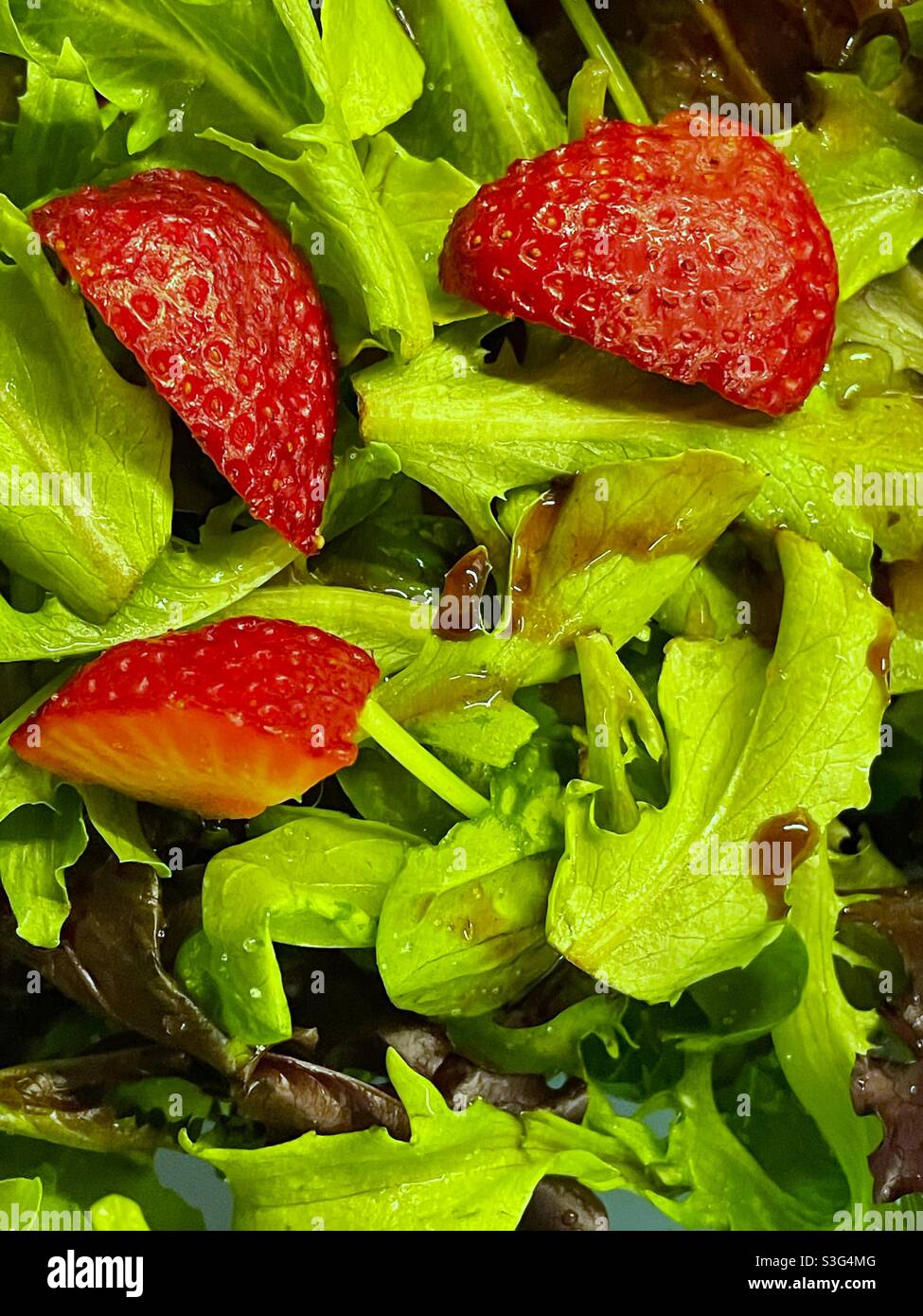 Green salad with strawberries Stock Photo Alamy