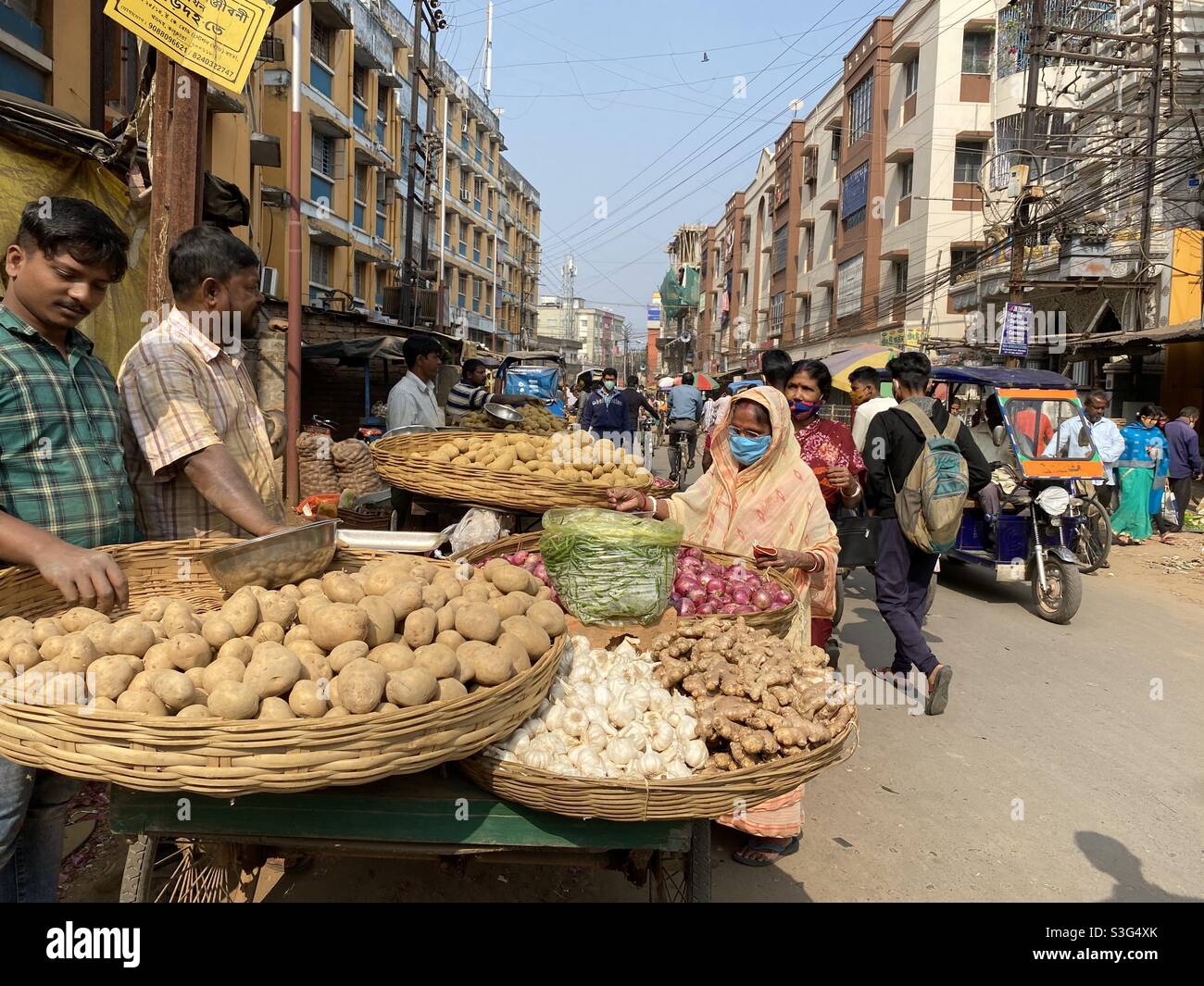 A vegetable seller standing roadside and selling vegetables - Smartphone Captured Stock Image