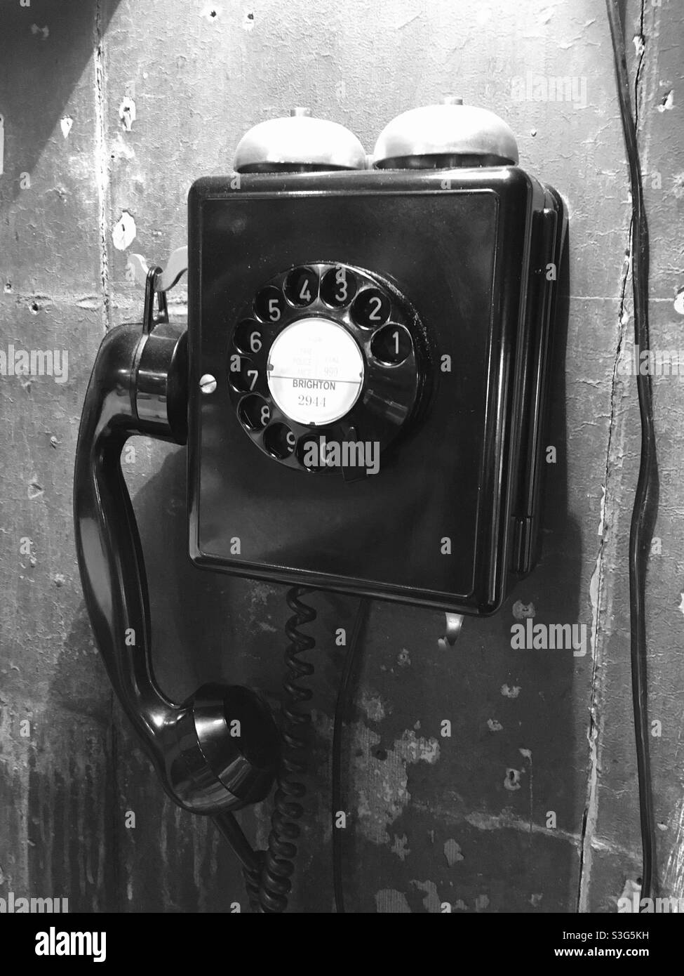 Old rotary phone in a vintage shop. Stock Photo