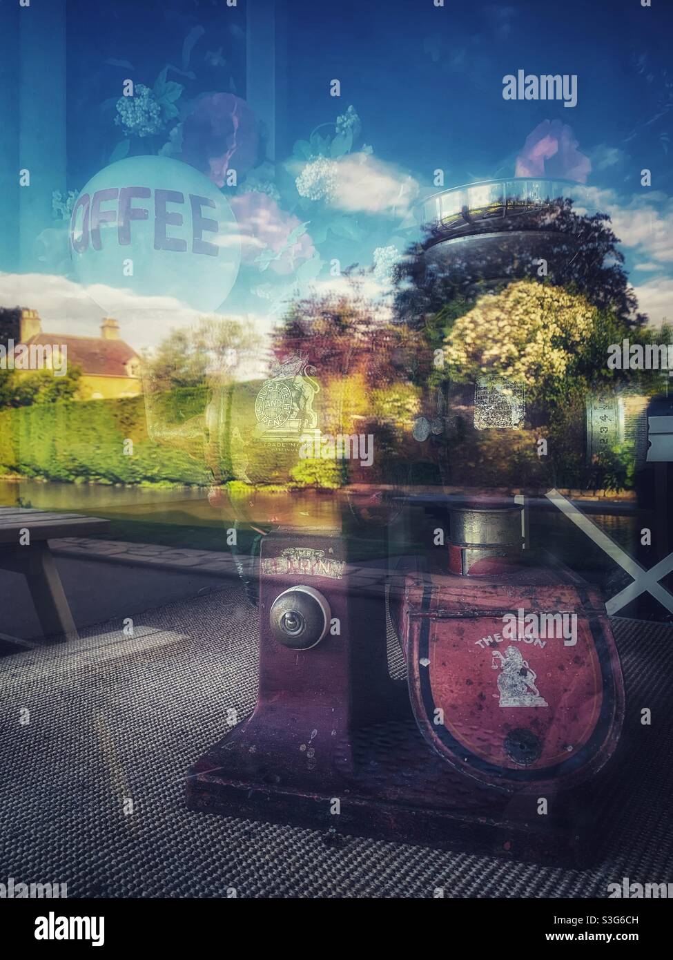 Reflection in a coffee shop window in Bourton on the Water, Cotswolds