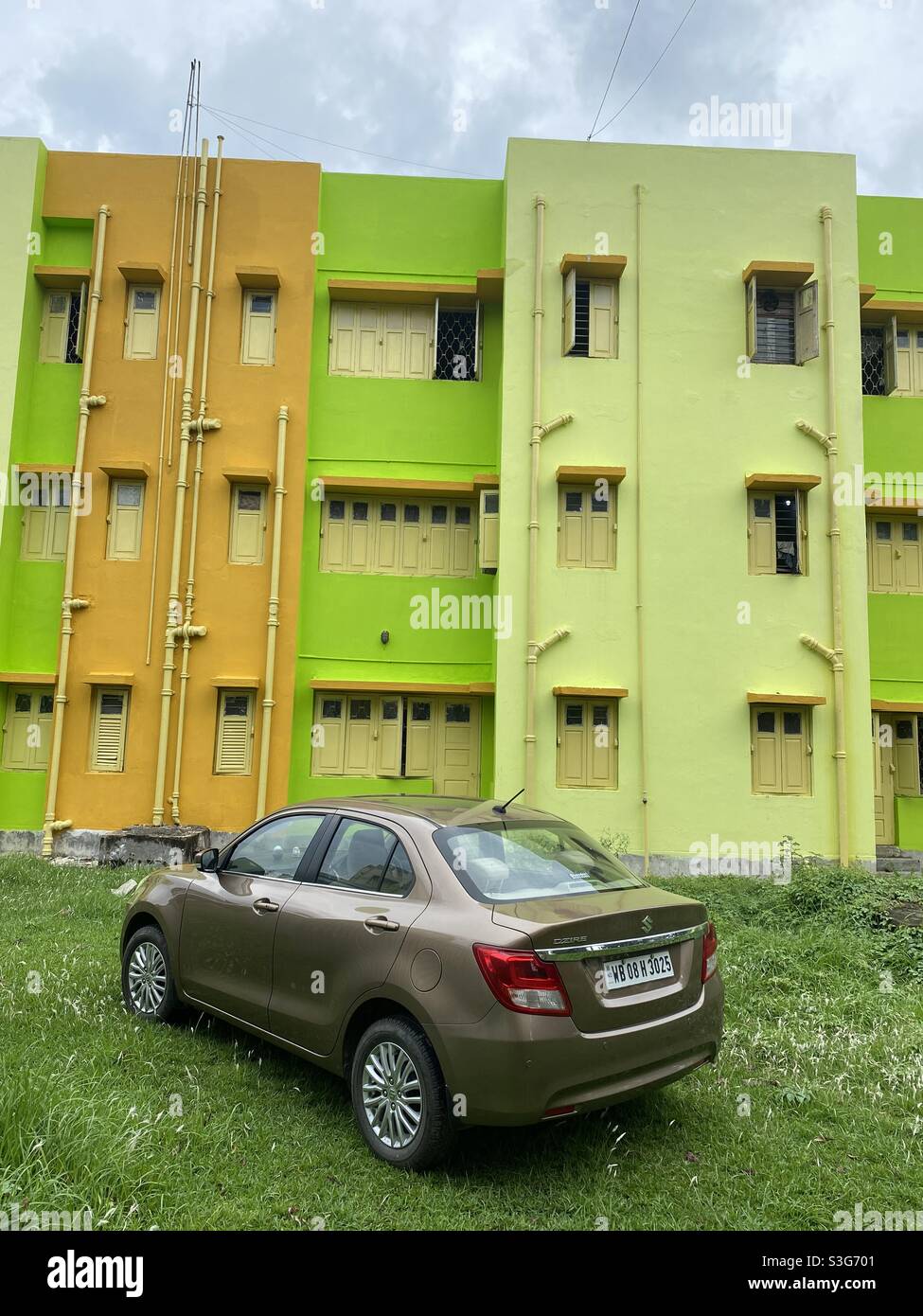 Luxury car standing in front of a colourful building - Smartphone Captured Stock Image