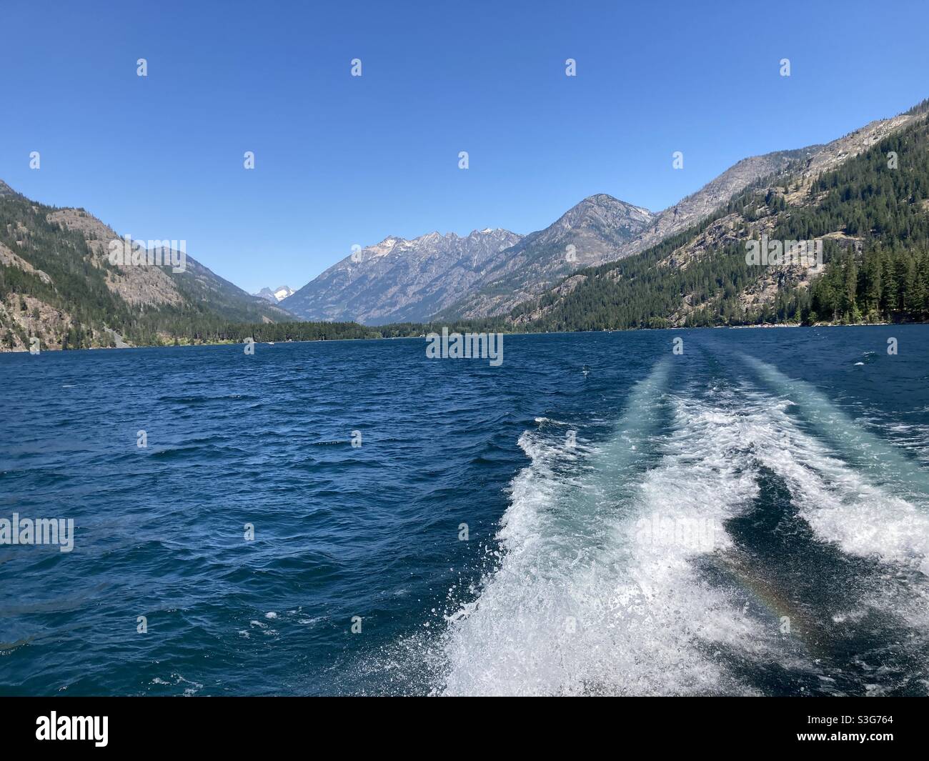 Wake trailing boat on Ross Lake in North Cascades National Park