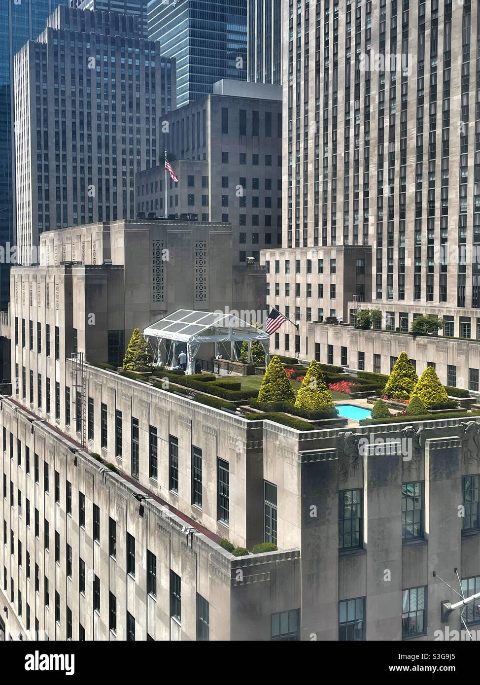 Formal rooftop garden and event space on top of a building in