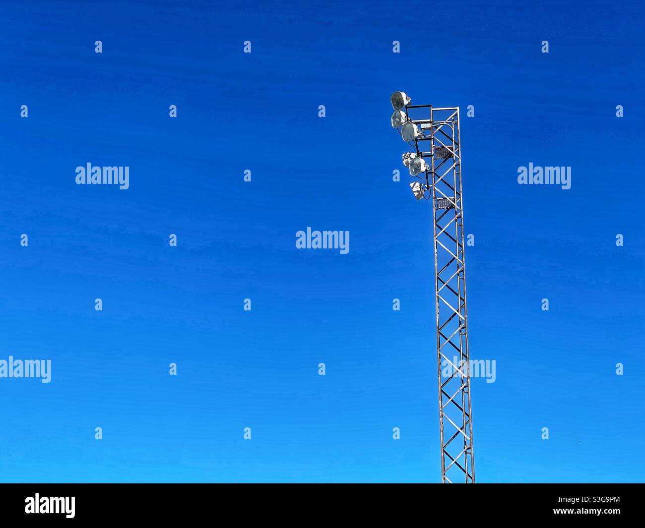 Low angle view of a lighting tower against blue sky - Smartphone Captured Stock Image
