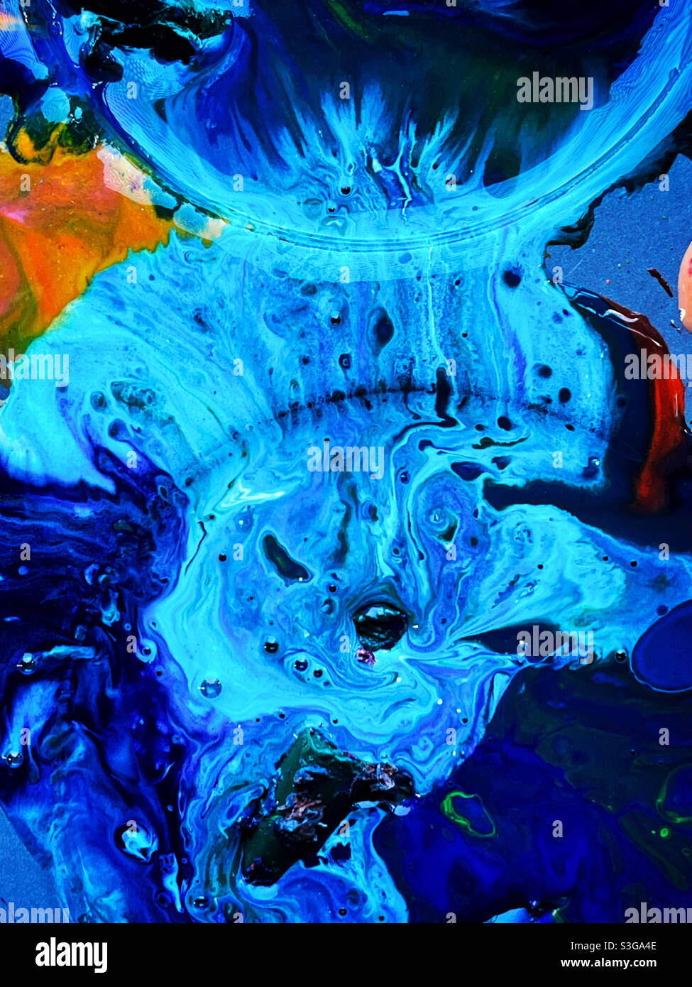 Blue galaxy melting crayons wax pouring - Smartphone Captured Stock Image