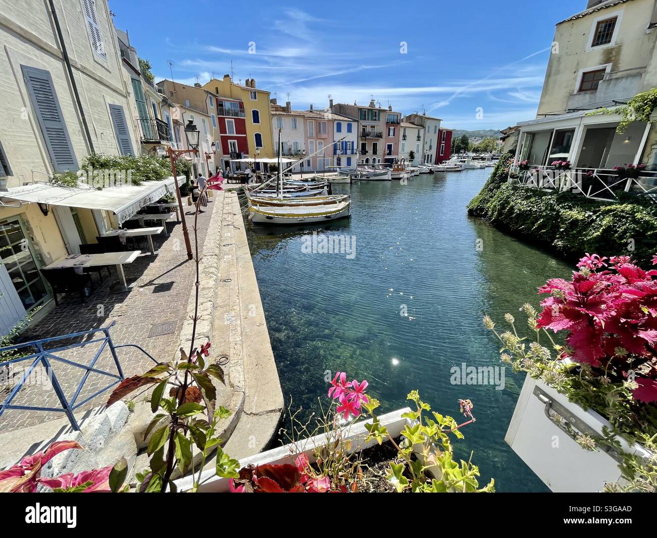 Canal with fishing boats, restaurants, flowers in Martigues, near Marseille, Bouches-du-Rhône, Provence-Alpes-Côte d'Azur, south of France - Smartphone Captured Stock Image