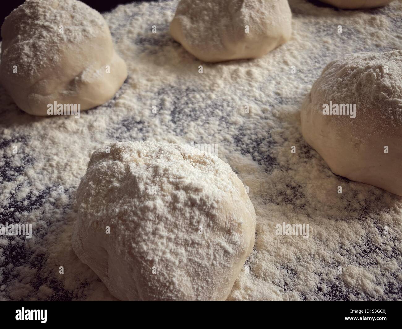 Four pieces of Pizza dough Proofing Stock Photo Alamy