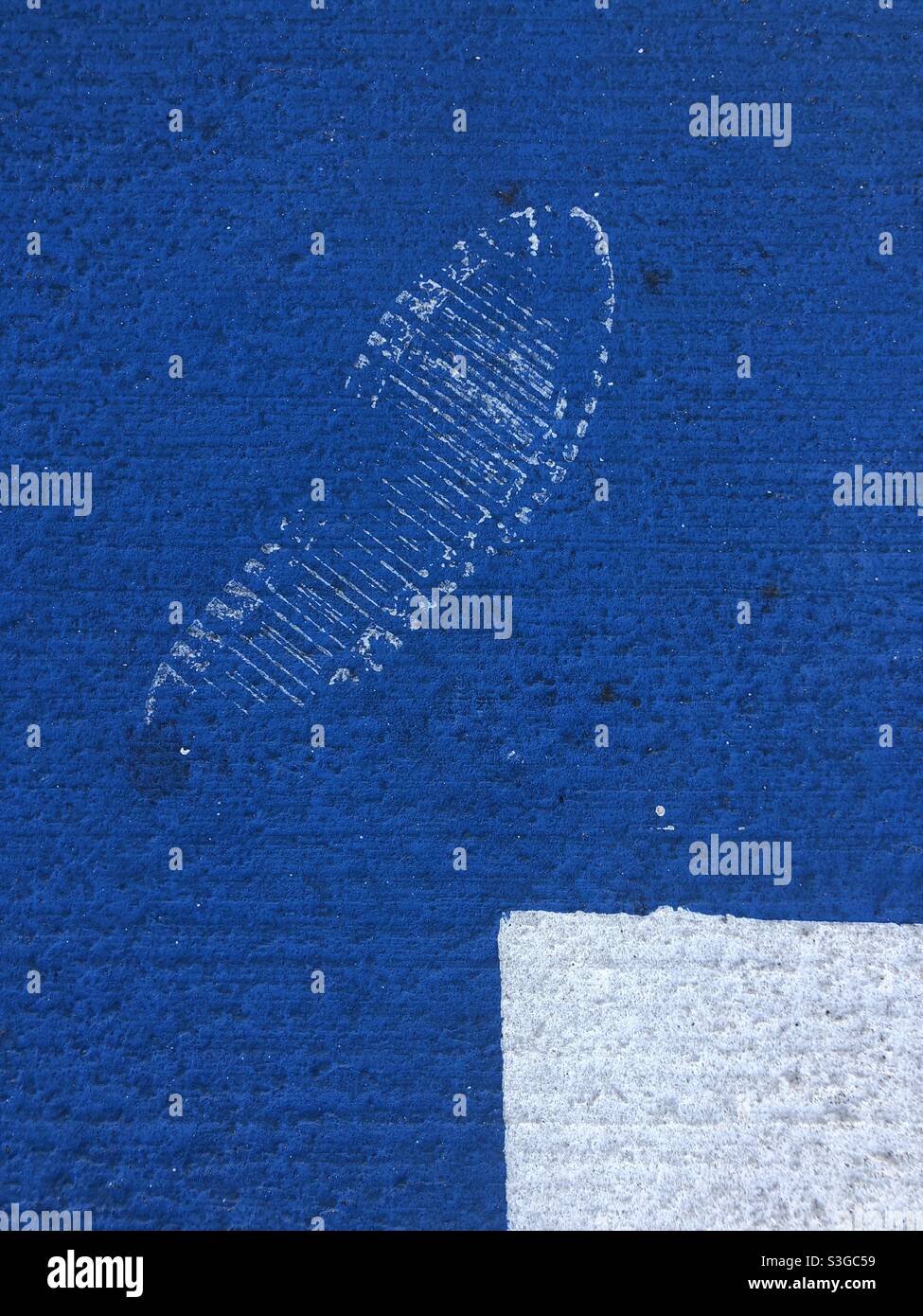 Footprint on blue painted surface - Smartphone Captured Stock Image