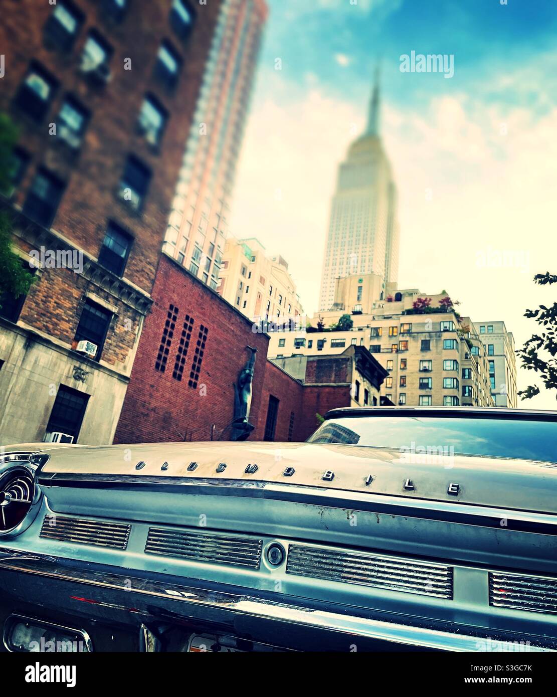 Vintage Oldsmobile automobile parked near the Empire State building in the Murray Hill neighborhood of new York city, USA - Smartphone Captured Stock Image