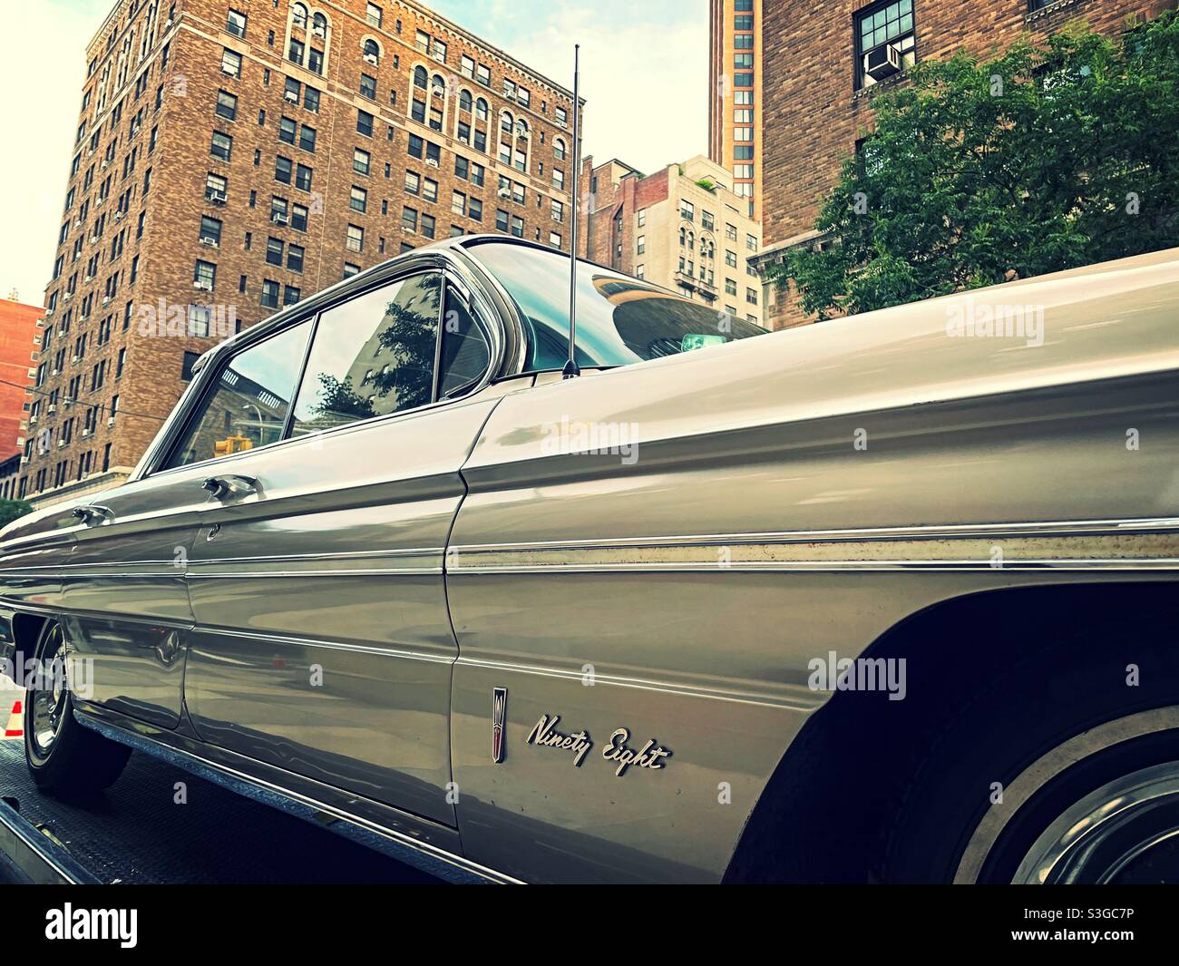 Vintage Oldsmobile 98 automobile parked in Midtown Manhattan, NYC, USA Stock Photo