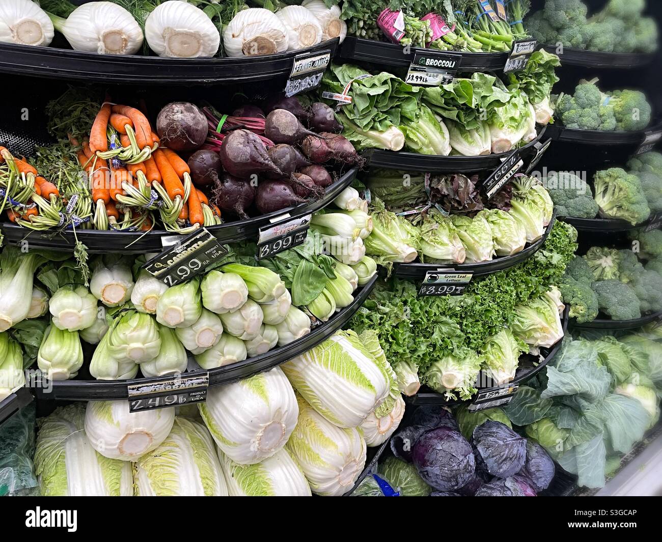 The grocery store produce section sells a large number of vegetables, USA - Smartphone Captured Stock Image