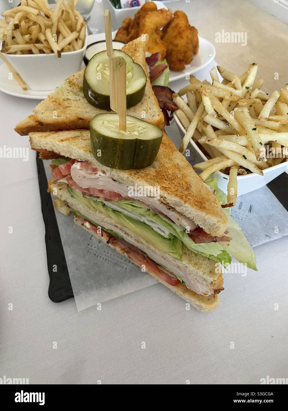 Turkey club sandwich and French fries Stock Photo Alamy