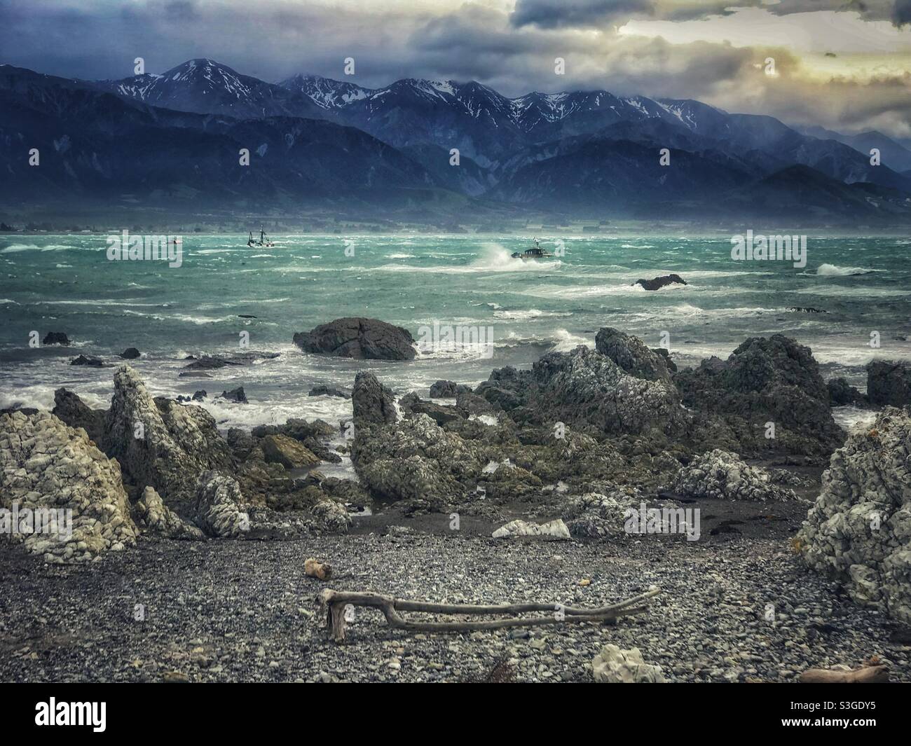 Rocky shore and view across the bay from Kaikoura on New Zealand’s South Island - Smartphone Captured Stock Image