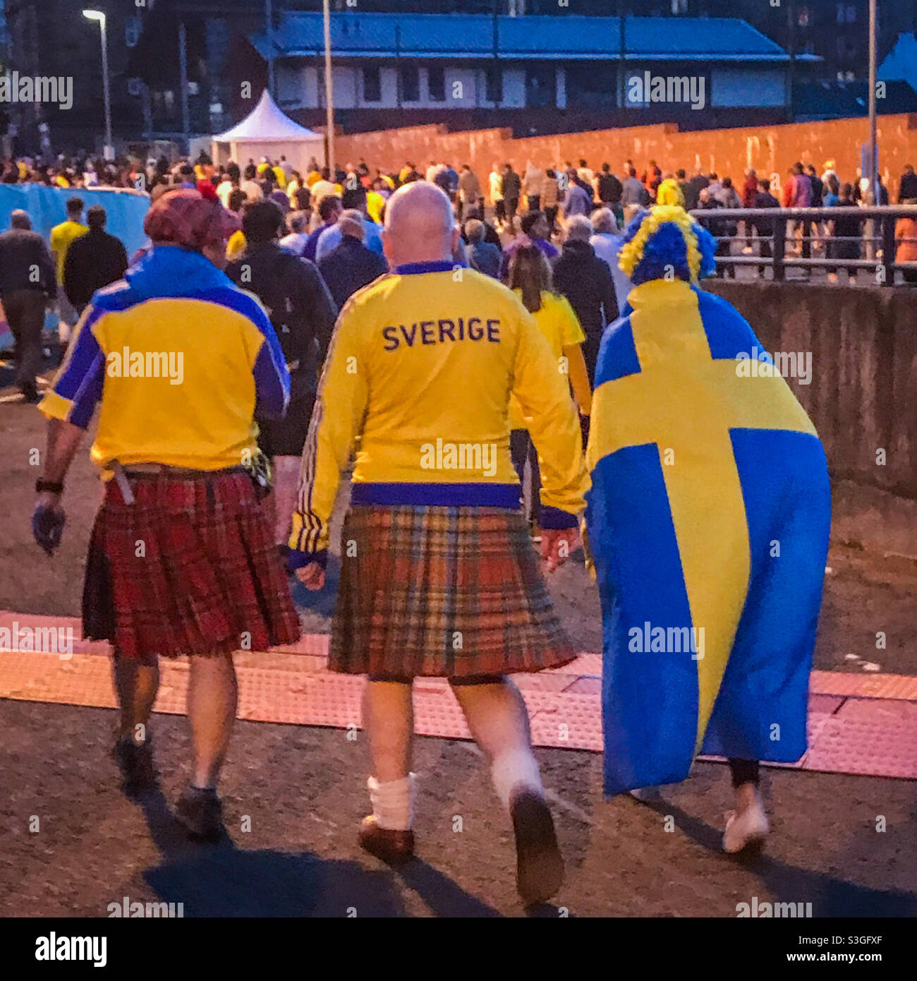 Football fans wearing Sweden tops and Scottish kilts at the Euro 2020 game between Sweden and Ukraine at Hampden Park in Glasgow, Scotland in June 2021 Stock Photo
