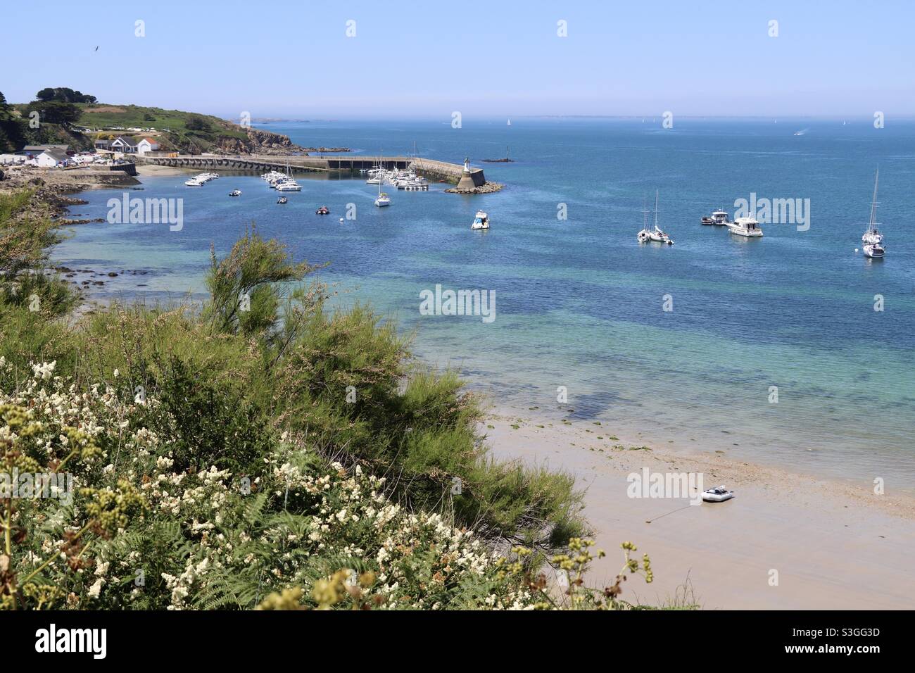 The beautiful harbor of the island of Houat in Brittany, Morbihan, France. Tropical colors of the sea - Smartphone Captured Stock Image