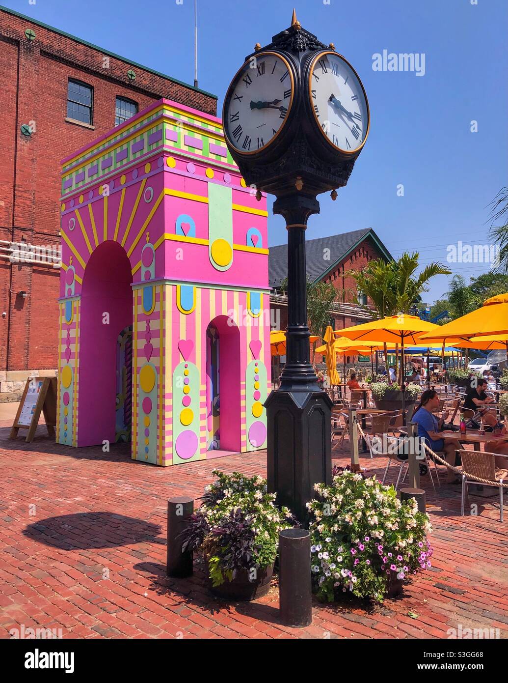 A bright, cheerful summer day at the historical Distillery District in a Toronto neighbourhood. - Smartphone Captured Stock Image