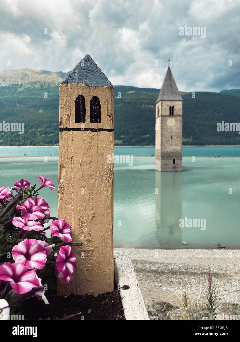 Church steeple in lake resia in Italy Stock Photo