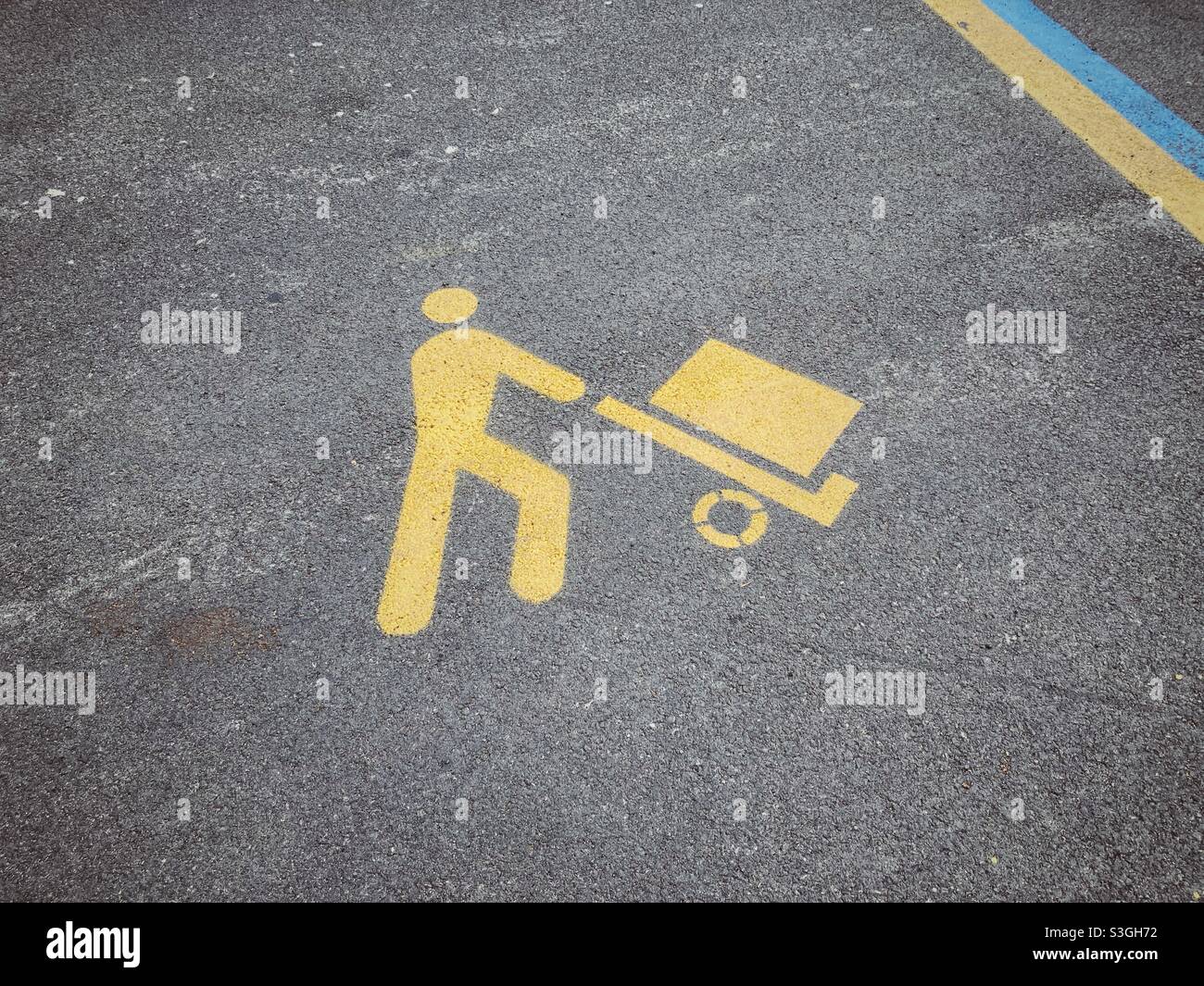 A reserved parking sign on the ground for goods loading vehicles only, Italy - Smartphone Captured Stock Image