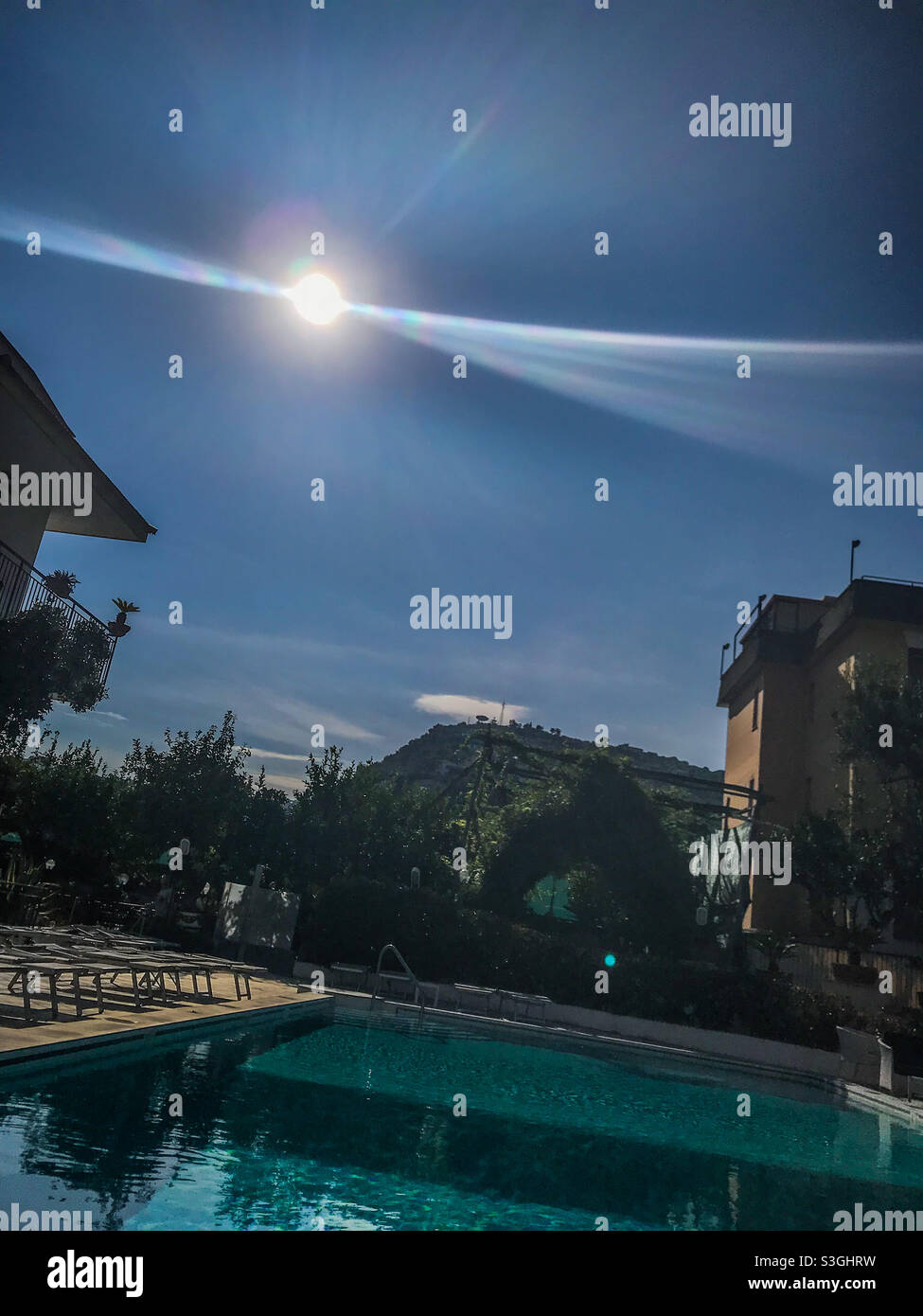 Sunshine over Italian swimming pool - Smartphone Captured Stock Image