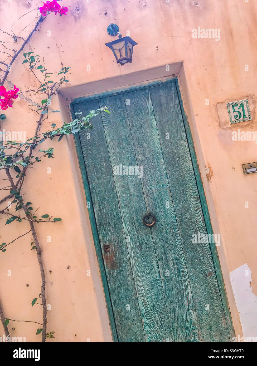 Colourful door in a wall, Italy - Smartphone Captured Stock Image