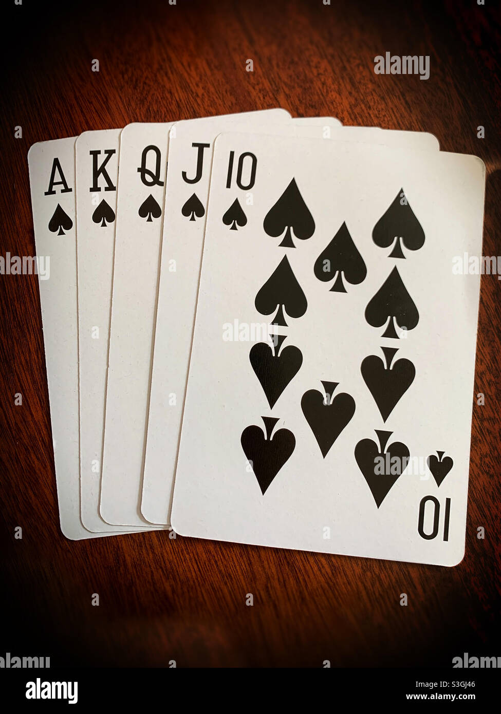Poker hand. Card game. Gambling.  Royal flush - Smartphone Captured Stock Image