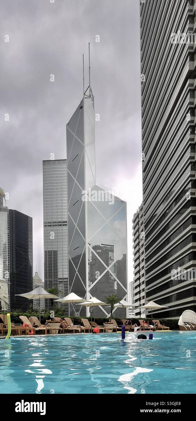 The Bank of China tower viewed from the swimming pool of the Shangri-La hotel in Hong Kong. - Smartphone Captured Stock Image