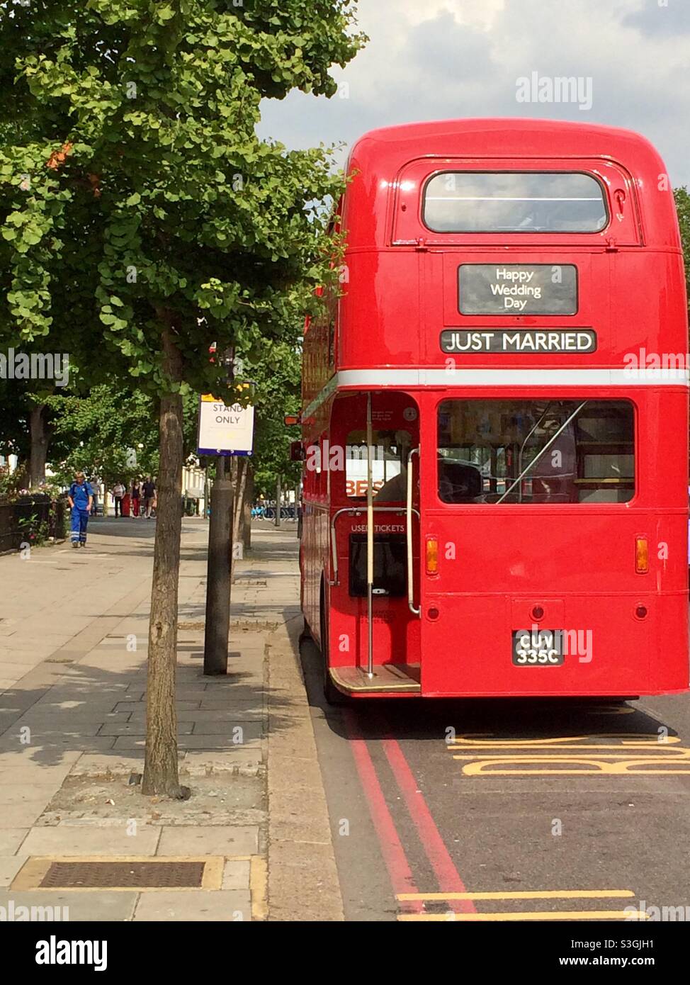 AEC Routemaster old red double-decker bus converted into a party bus on street in Kensington and Chelsea Borough, London, England, UK - Smartphone Captured Stock Image