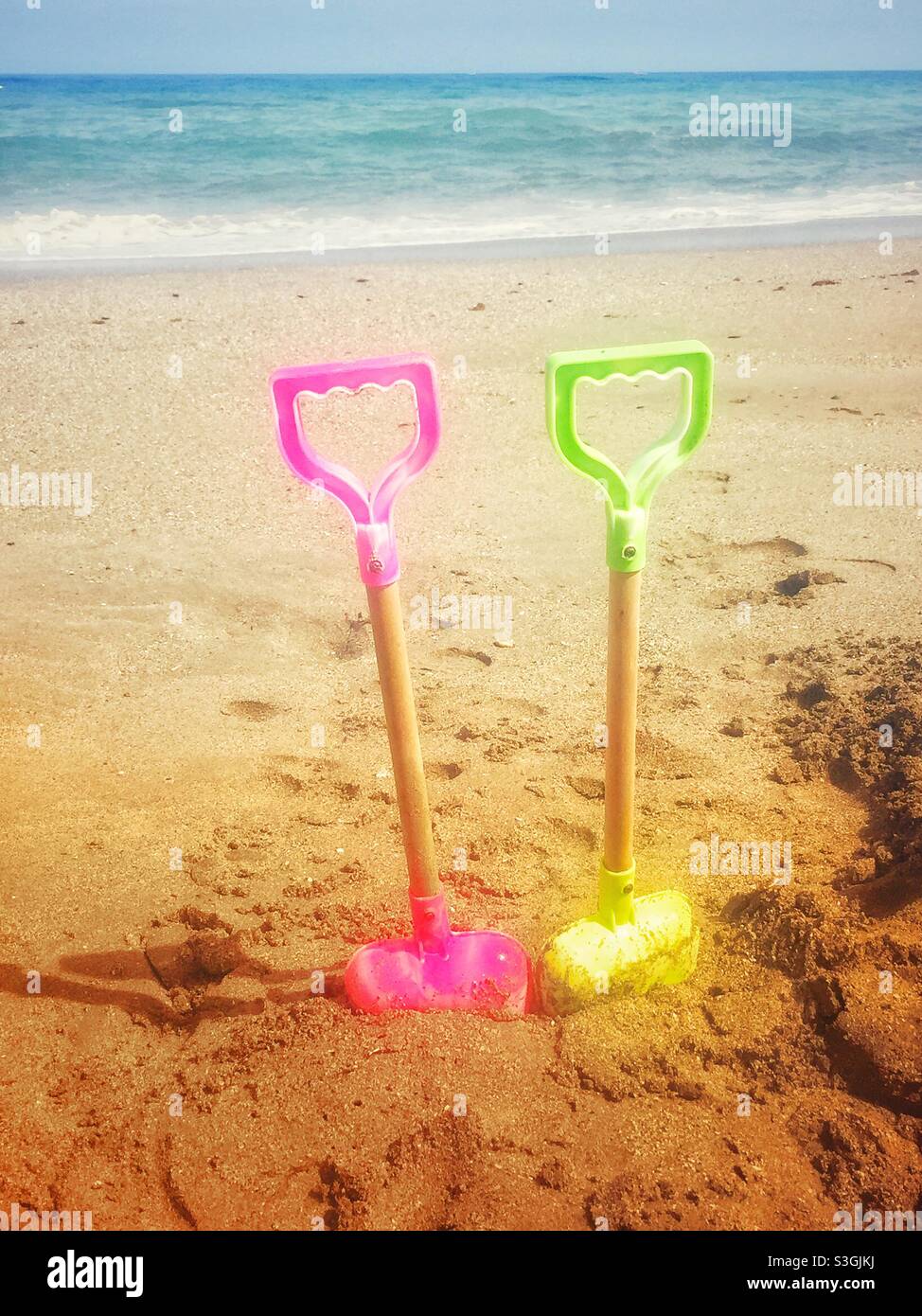 Two spades on a beach - Smartphone Captured Stock Image